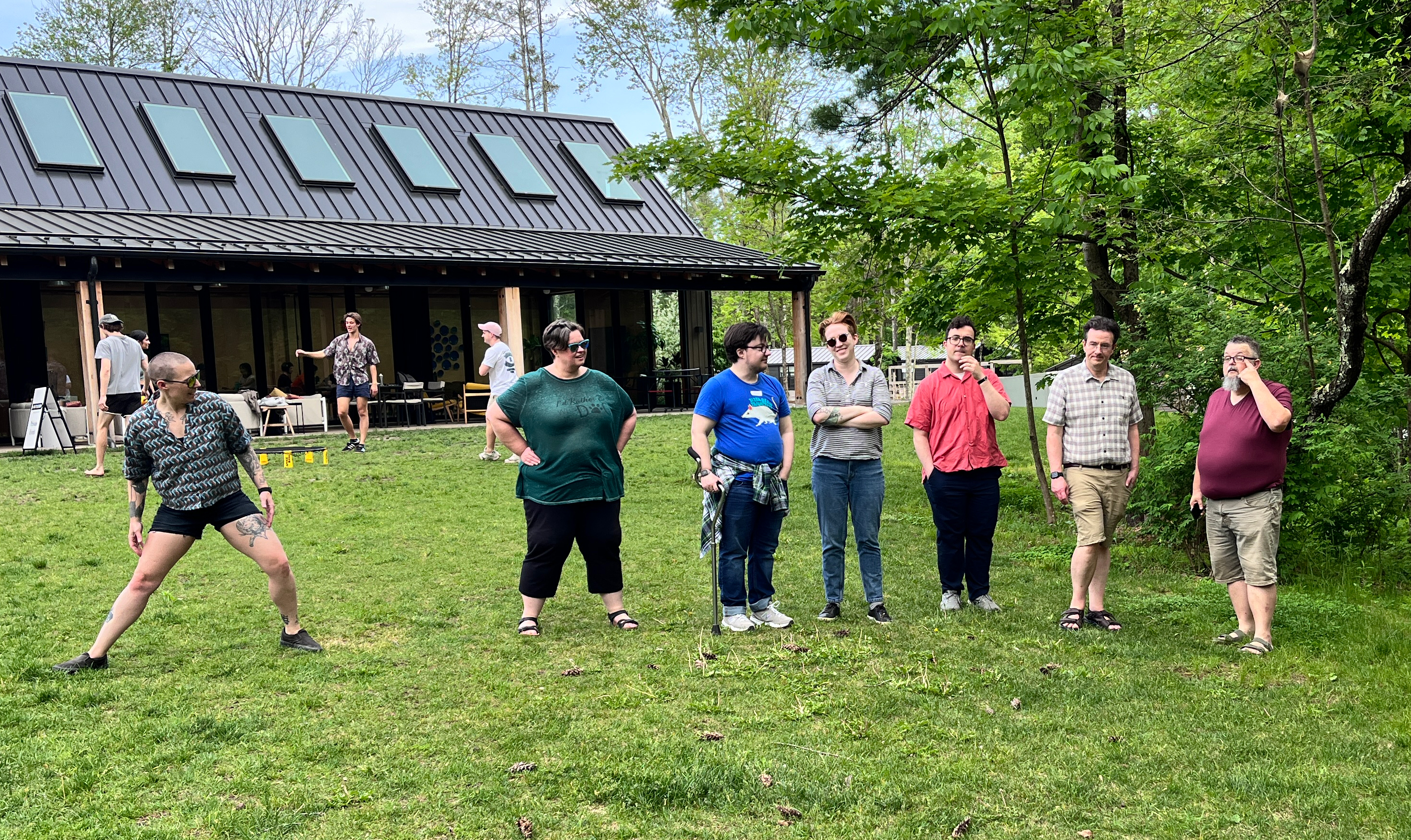 A group of Flagrant team members, outside in a line in the Catskills mountain region