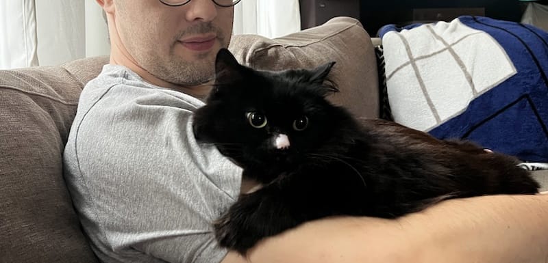 This is Burger King a black cat held by one of her loving cat-parents.